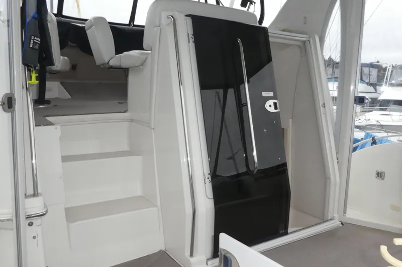 Slide: The Image of Interior view of 2006 Carver 366 Motor Yacht with stairs and seating area. - 10