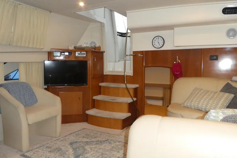 Slide: The Image of Luxurious interior of 2006 Carver 366 Motor Yacht with cozy seating and entertainment area. - 13