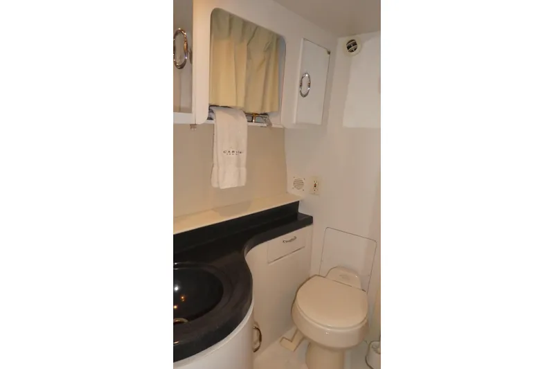 Slide: The Image of Bathroom interior of 2006 Carver 366 Motor Yacht with sink and toilet. - 31