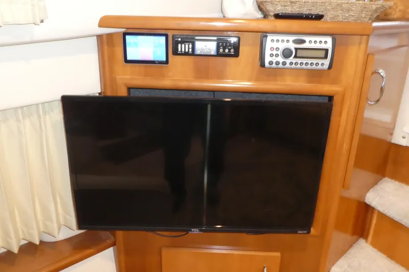 Slide: The Image of Entertainment system in 2006 Carver 366 Motor Yacht with TV and control panel. - 38