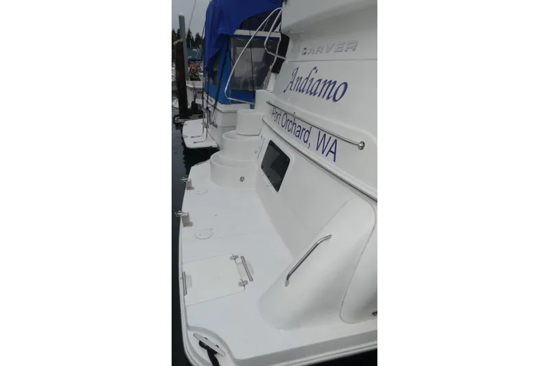 Slide: The Image of 2006 Carver 366 Motor Yacht docked, featuring "Andiamo" and Port Orchard, WA lettering. - 52