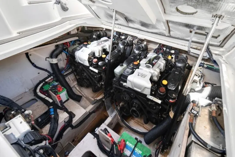 Slide: The Image of Engine compartment of a 2015 Sea Ray Sundancer 350 with twin V8 engines. - 11