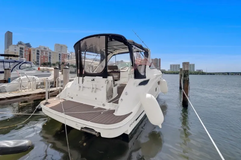 Slide: The Image of 2015 Sea Ray Sundancer 350 yacht docked in urban marina setting. - 5