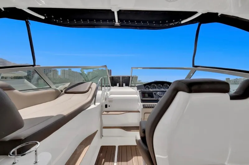 Slide: The Image of Interior view of 2015 Sea Ray Sundancer 350 yacht cockpit with modern seating and controls. - 7