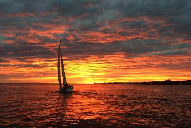 Slide: The Image of Sailboat on vibrant sunset ocean, Bill Lee Yachts Santa Cruz 50, 1986 model. - 39