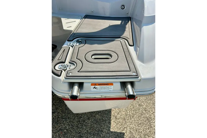 Slide: The Image of 2017 Four Winns 180 Horizon boat swim platform with integrated ladder and warning label. - 14