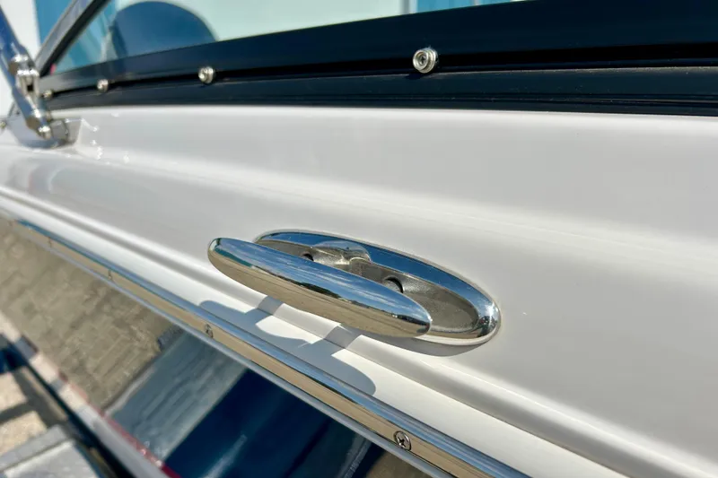 Slide: The Image of Close-up of a 2017 Four Winns 180 Horizon boat's sleek chrome handle detail. - 18
