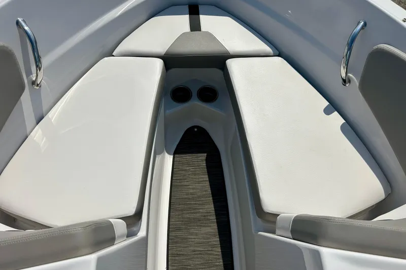 Slide: The Image of Bow seating area of a 2017 Four Winns 180 Horizon boat with white cushions. - 19