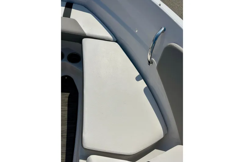 Slide: The Image of 2017 Four Winns 180 Horizon boat interior with white seating and chrome handle. - 22