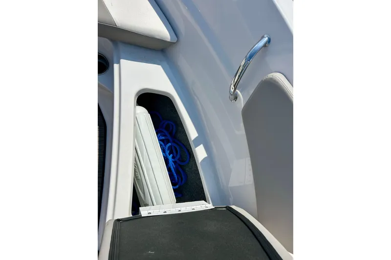 Slide: The Image of Storage compartment on 2017 Four Winns 180 Horizon boat with blue rope and fender. - 23