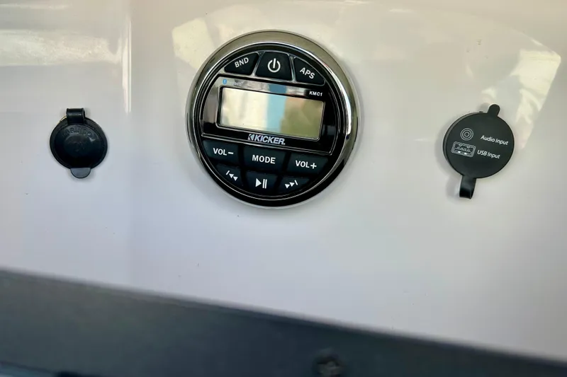 Slide: The Image of Control panel of a 2017 Four Winns 180 Horizon boat with audio input and USB port. - 36