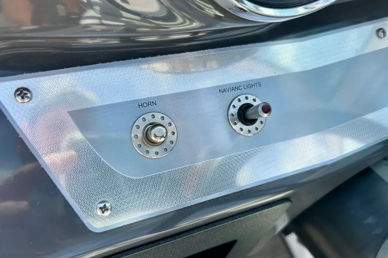 Slide: The Image of Control panel of 2017 Four Winns 180 Horizon boat with horn and navigation lights switches. - 37