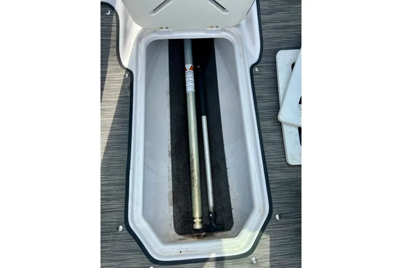 Slide: The Image of Storage compartment of 2017 Four Winns 180 Horizon boat with equipment inside. - 41