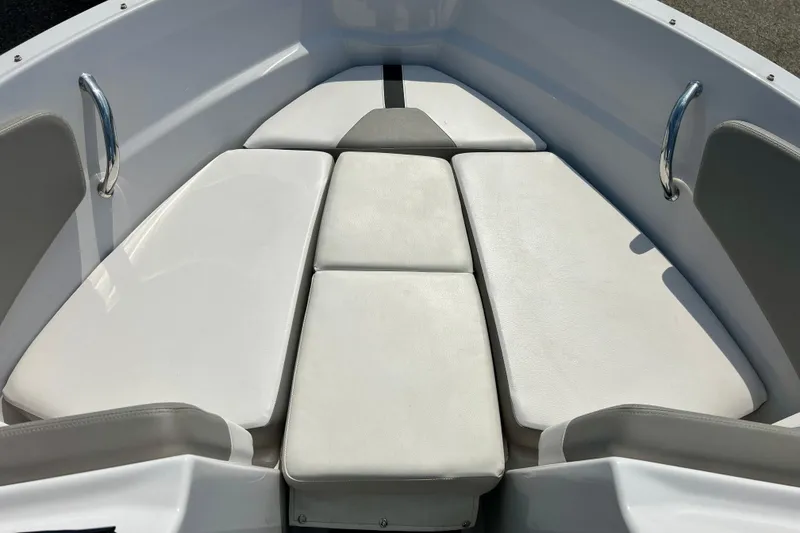 Slide: The Image of Bow seating area of 2017 Four Winns 180 Horizon boat with white cushions. - 42