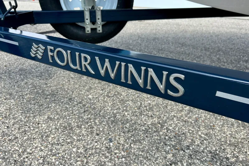 Slide: The Image of Four Winns 180 Horizon 2017 trailer with logo on pavement background. - 43