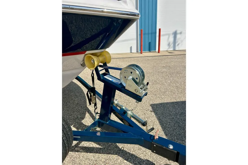 Slide: The Image of 2017 Four Winns 180 Horizon boat on trailer with winch in sunny outdoor setting. - 9