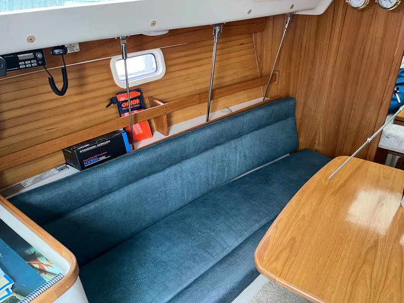 Slide: The Image of Interior of a 2000 Catalina 28 MkII yacht with blue seating. - 14