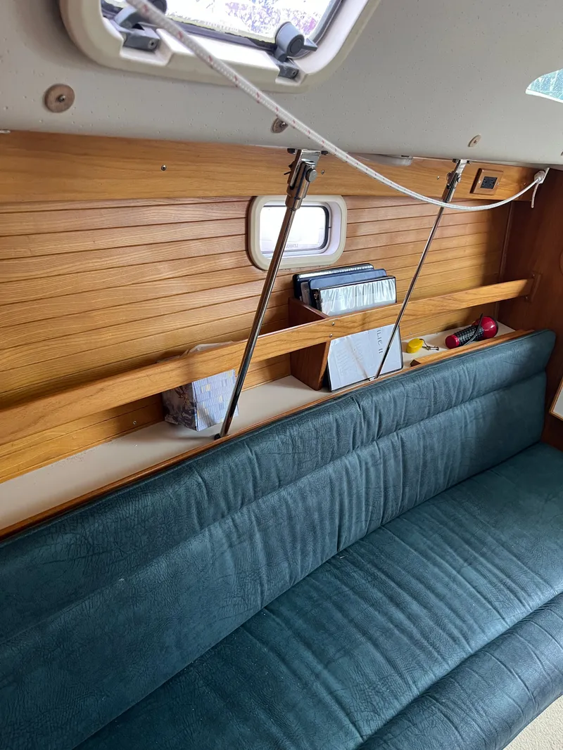 Slide: The Image of Interior of a 2000 Catalina 28 MkII yacht with wooden walls and seating. - 20