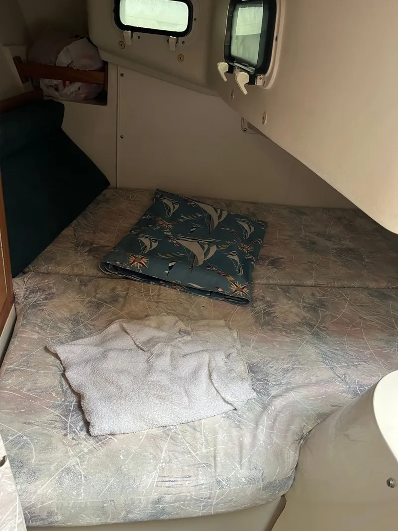 Slide: The Image of Interior of a Catalina 28 MkII yacht, sleeping area with bed. - 8