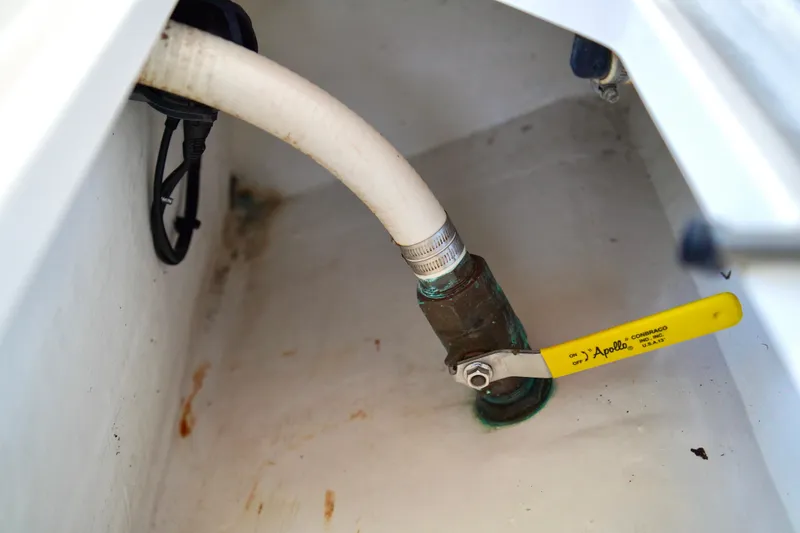 Slide: The Image of Bilge area of 2019 Invincible 36 Open Fisherman with valve and hose connection. - 18