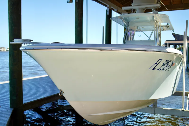Slide: The Image of 2019 Invincible 36 Open Fisherman boat docked by the water. - 2