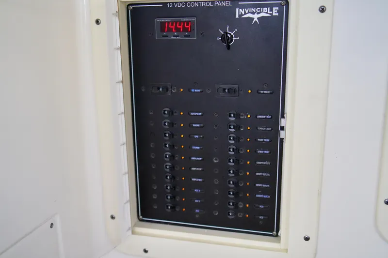 Slide: The Image of Control panel of a 2019 Invincible 36 Open Fisherman boat, displaying 12 VDC system. - 23