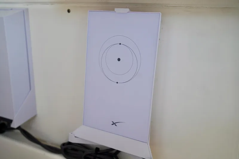 Slide: The Image of Wall-mounted Starlink satellite internet receiver on a 2019 Invincible 36 Open Fisherman boat. - 24