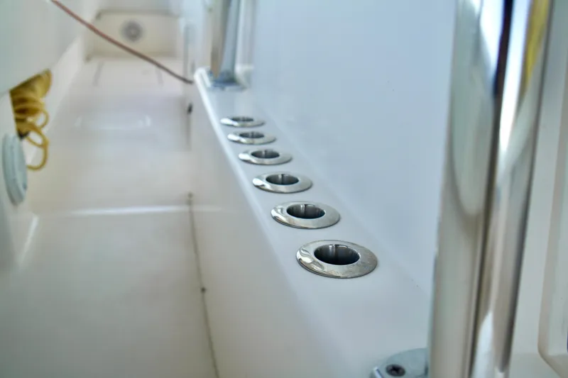 Slide: The Image of 2019 Invincible 36 Open Fisherman boat interior with rod holders. - 26