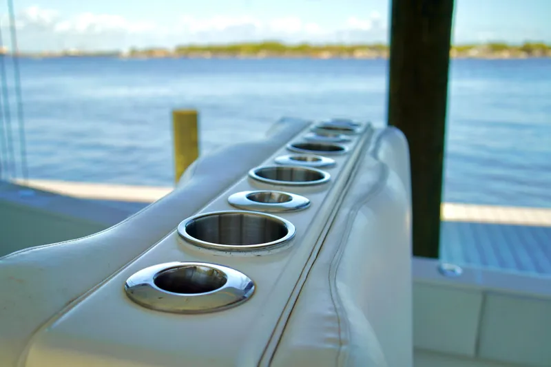 Slide: The Image of Rod holders on a 2019 Invincible 36 Open Fisherman boat, overlooking serene water. - 28