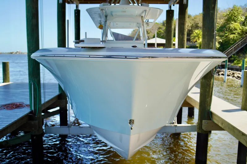 Slide: The Image of 2019 Invincible 36 Open Fisherman boat docked by the water. - 3