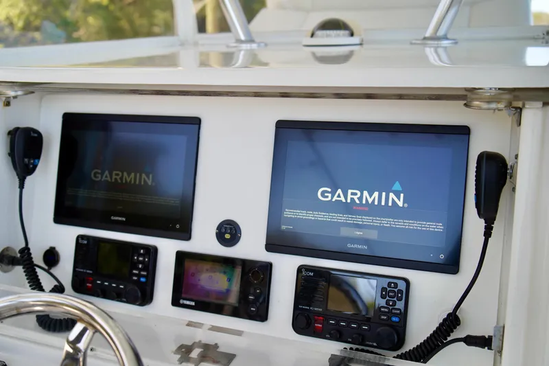 Slide: The Image of Control panel of a 2019 Invincible 36 Open Fisherman with Garmin navigation displays. - 32