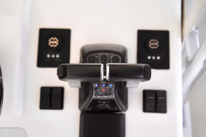 Slide: The Image of Control panel of a 2019 Invincible 36 Open Fisherman boat, featuring throttle levers. - 39