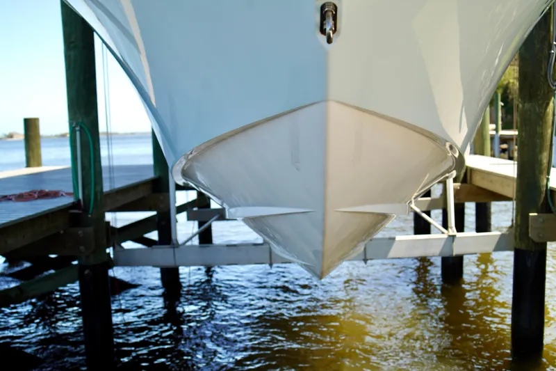 Slide: The Image of 2019 Invincible 36 Open Fisherman boat docked, showcasing sleek hull design. - 4