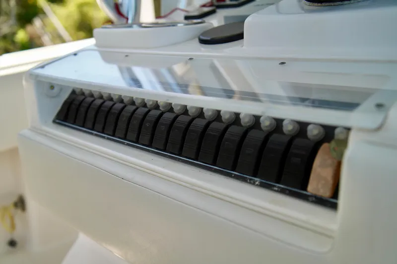 Slide: The Image of Control panel of a 2019 Invincible 36 Open Fisherman boat, featuring multiple switches. - 41
