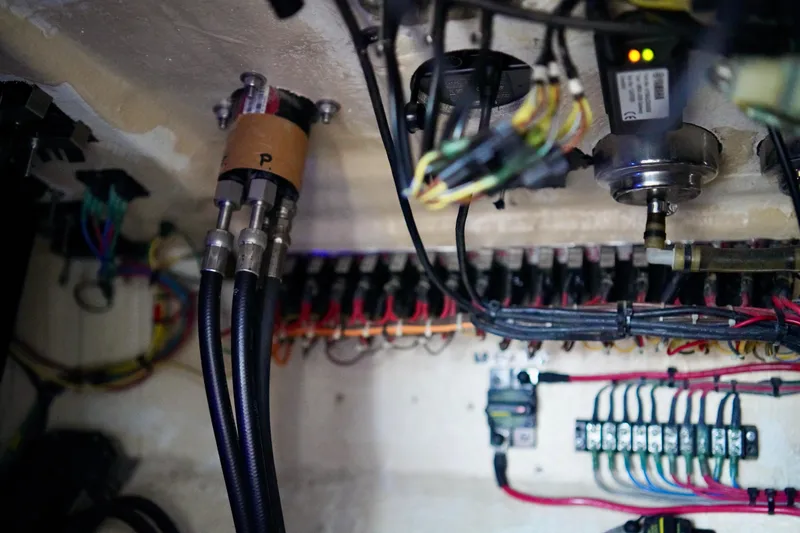 Slide: The Image of Electrical wiring and components inside a 2019 Invincible 36 Open Fisherman boat. - 42