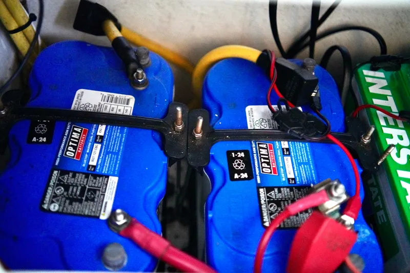 Slide: The Image of Batteries in a 2019 Invincible 36 Open Fisherman boat, featuring Optima and Interstate brands. - 44