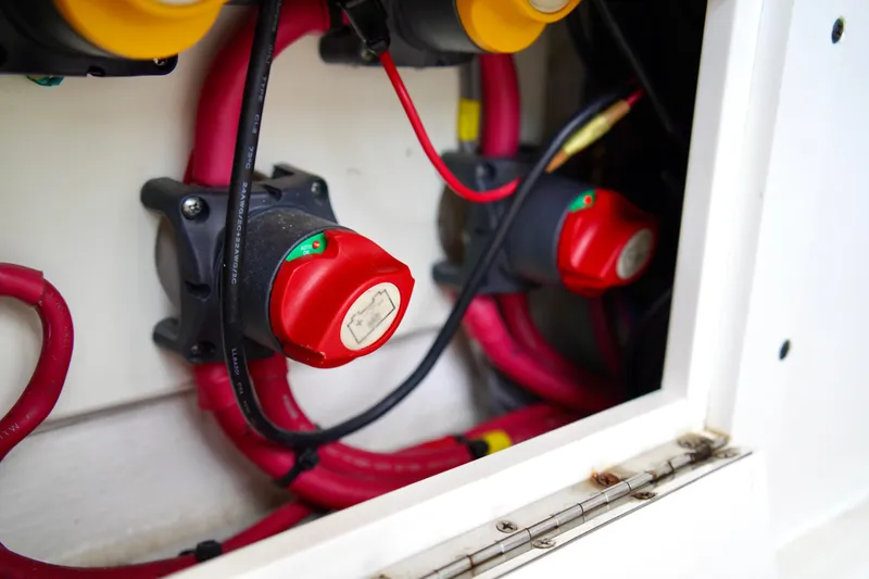 Slide: The Image of Electrical system of 2019 Invincible 36 Open Fisherman boat with red cables and switches. - 45