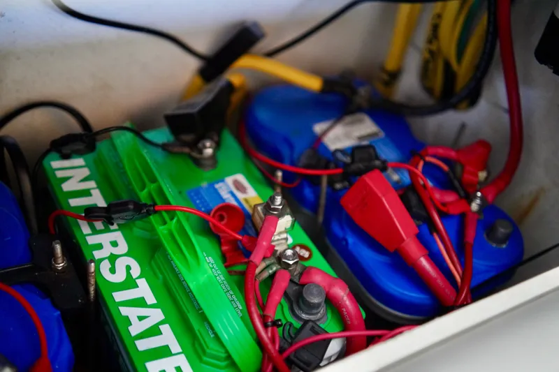 Slide: The Image of Batteries and wiring inside a 2019 Invincible 36 Open Fisherman boat. - 46
