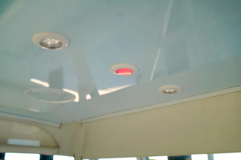 Slide: The Image of Ceiling lights on 2019 Invincible 36 Open Fisherman boat interior. - 50
