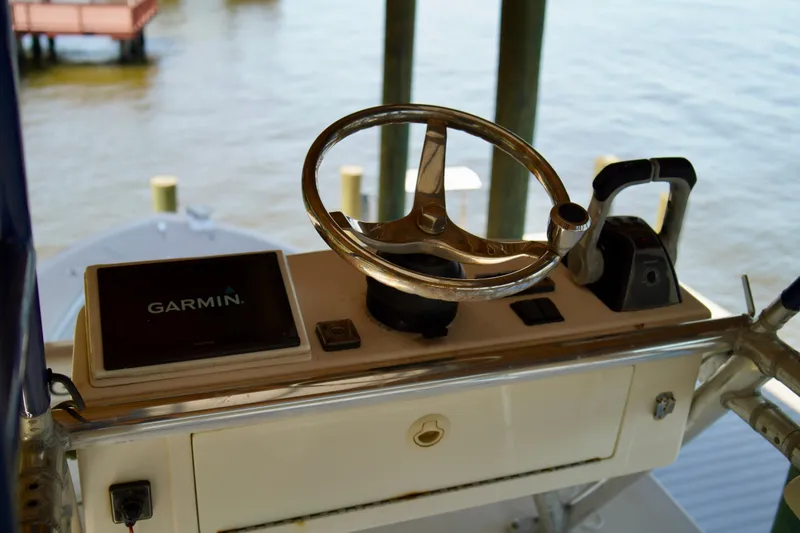 Slide: The Image of 2019 Invincible 36 Open Fisherman helm with Garmin display and steering wheel. - 55