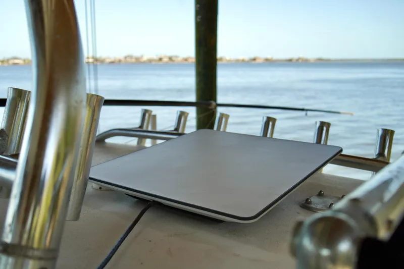 Slide: The Image of Satellite dish on 2019 Invincible 36 Open Fisherman boat, overlooking calm waters. - 57