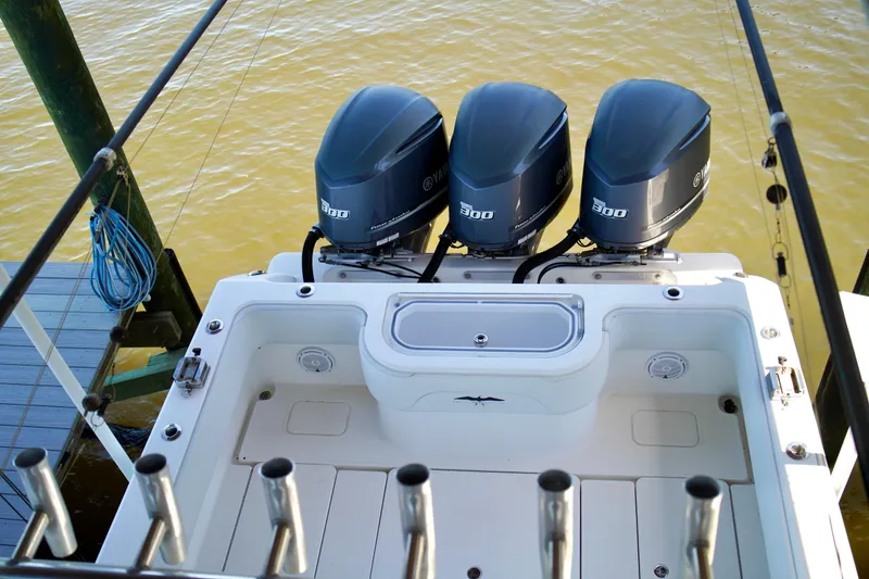 Slide: The Image of 2019 Invincible 36 Open Fisherman with triple outboard engines at dock. - 59