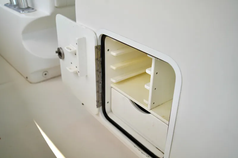 Slide: The Image of Open storage compartment on 2019 Invincible 36 Open Fisherman boat. - 60