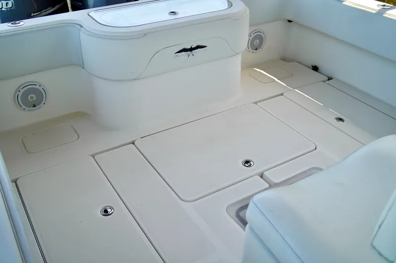 Slide: The Image of 2019 Invincible 36 Open Fisherman boat deck with storage compartments and speakers. - 61