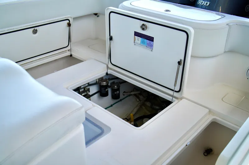 Slide: The Image of 2019 Invincible 36 Open Fisherman boat storage compartments and engine access. - 62