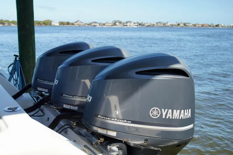 Slide: The Image of Triple Yamaha outboard engines on a 2019 Invincible 36 Open Fisherman boat. - 67