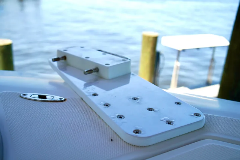 Slide: The Image of 2019 Invincible 36 Open Fisherman boat detail with mounting plate by the water. - 9