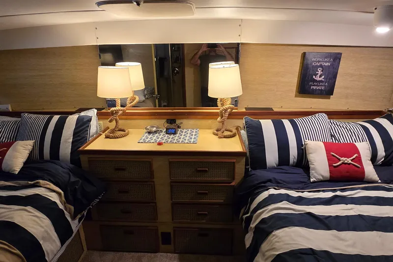 Slide: The Image of Cozy 1977 Bertram 42 Flybridge Motor Yacht cabin with nautical decor and twin beds. - 41