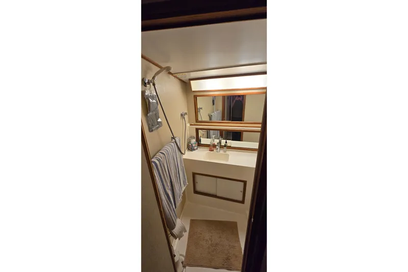 Slide: The Image of Bathroom interior of 1977 Bertram 42 Flybridge Motor Yacht with mirror and sink. - 48