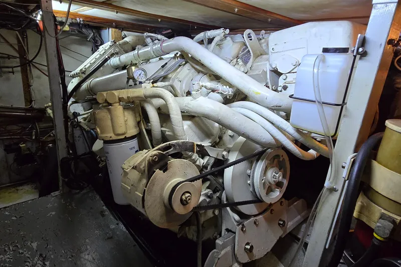 Slide: The Image of Engine room of a 1977 Bertram 42 Flybridge Motor Yacht, showcasing mechanical components. - 57